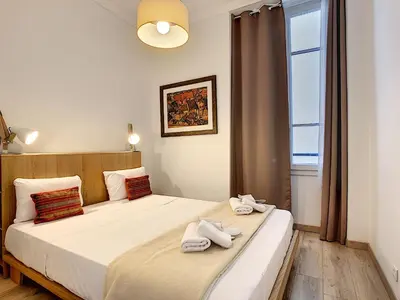 a bedroom with a bed with towels on it at Nestor&Jeeves - COTE JARDIN - Central - Close sea in Nice