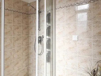 a shower with a glass door in a bathroom at #12 1BDR Joffre, Central 5min from Old Town AC & WIFI in Nice