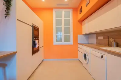 a living room with a couch and a fireplace at Nice - Beautiful bright apartment - 10 min beach in Nice