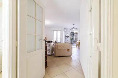 a hallway with a door leading to a living room at Nice Luxury in Nice
