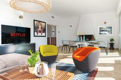 a living room with a couch and chairs at Villa Grenouillere - Vue Mer - Fitness - Sauna in Cagnes-sur-Mer