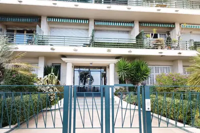 a building with a gate in front of it at Charming T1 with terrace and sea view in Nice