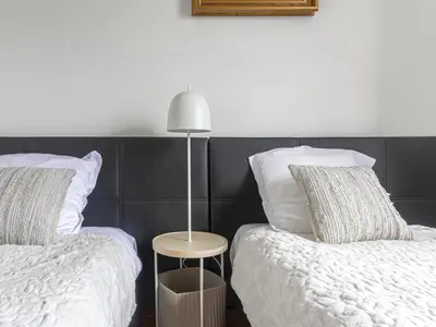 a bedroom with two beds and a lamp on it at Holiday Home Le Mas de Gattières by Interhome in Gattières