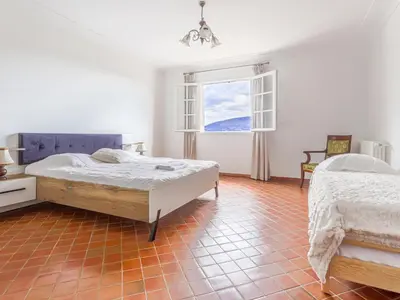 a bedroom with two beds and a window at Holiday Home Le Mas de Gattières by Interhome in Gattières