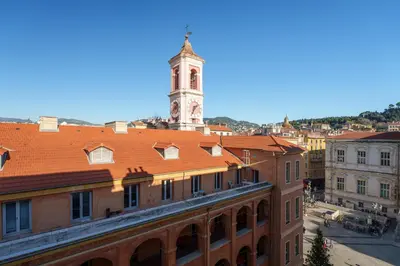 a view of a building with a clock tower at Cocon Place Massena, Cours Saleya et Mer in Nice