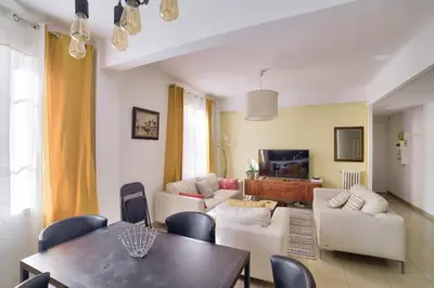 a living room with a couch and a table at Stunning 2BR by the Port 20min Walk to the Beach in Nice