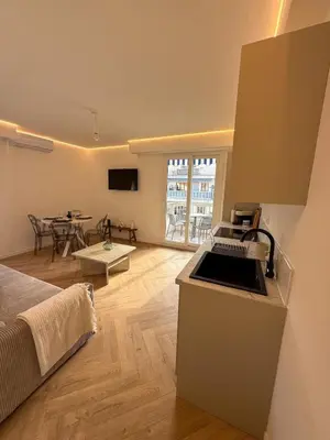 a kitchen and living room with a bed and a table at appartement port de Nice 4pers emplacement idéal in Nice