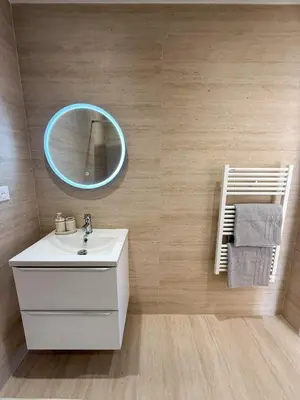 a bathroom with a white sink and a mirror at appartement port de Nice 4pers emplacement idéal in Nice