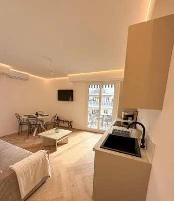 a kitchen and living room with a bed and a table at appartement port de Nice 4pers emplacement idéal in Nice