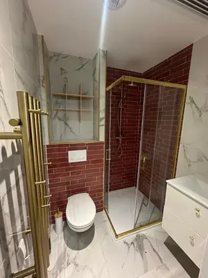 a bathroom with a toilet and a glass shower at MOON - 33 in Nice