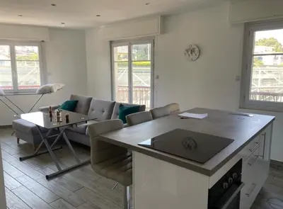 a living room with a couch and a table at Vacances à Nice in Nice