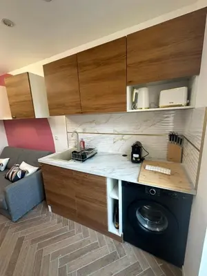 a kitchen with a washing machine in a room at MOON - 43 in Nice
