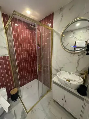 a bathroom with a shower and a sink and a mirror at MOON - 43 in Nice