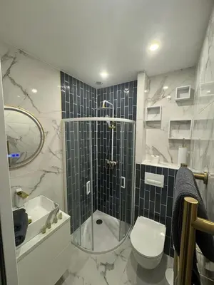 a bathroom with a shower and a toilet and a sink at MOON - 45 in Nice