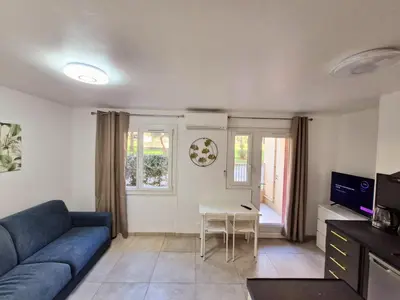 a living room with a couch and a table at appartement 2 pégurier in Nice