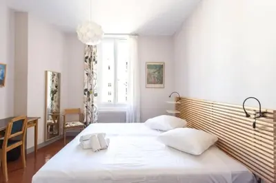 a bedroom with a bed with two white pillows at PANTHEON- App centre, 2 ch, 2 sdb , classé 4 étoiles in Nice