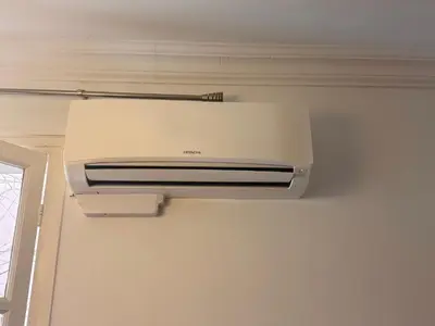 a printer hanging on a wall in a room at FLEUR- Cosy Studio, 200 Promenade des Anglais et Negresco, wifi, climatisation- calme in Nice