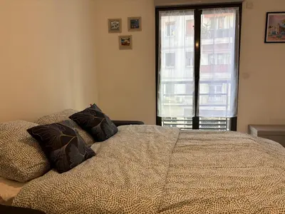 a bedroom with a bed with two pillows on it at Coeur de Nice in Nice