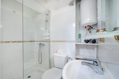 a bathroom with a shower and a toilet and a sink at Cosy studio proche Gare de Nice in Nice