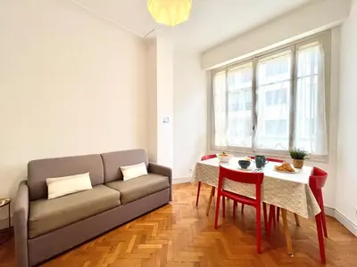 a living room with a couch and a table at Belle Nuit in Nice