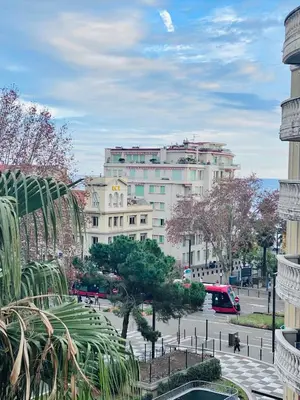 a large white building with trees in front of it at Appart T2 refait à neuf 50m2 in Nice