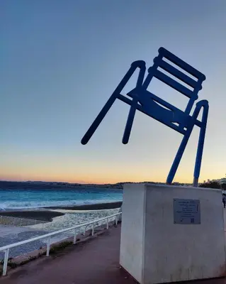 a chair sitting on top of a box on a beach at Carré d'Or - Studio lumineux à 5 minutes de la plage in Nice
