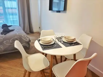 a dining room with a table and chairs at Charming apartment in Nice in Nice