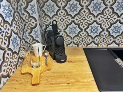 a desk with a phone and two glasses on it at Charming apartment in Nice in Nice