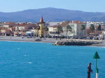 a person standing on the beach near the water at Apartment Cagnes Provencal by Interhome in Cagnes-sur-Mer