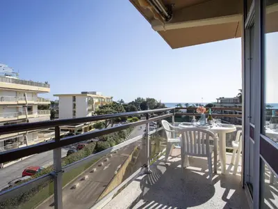 a balcony with a table and chairs and a view at Apartment Heliotel Marine-2 by Interhome in Saint-Laurent-du-Var