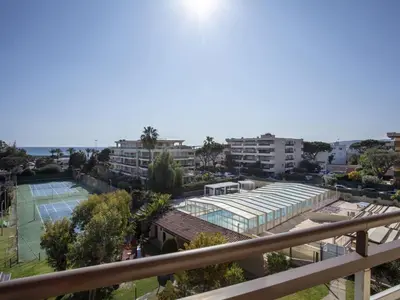 a view of a tennis court and some buildings at Apartment Heliotel Marine-2 by Interhome in Saint-Laurent-du-Var