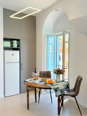 a kitchen with a table with fruit on it at NEPTUNE AP4453 By Riviera Holiday Homes in Villefranche-sur-Mer