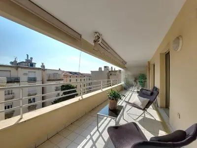 a balcony with chairs and a table on a building at Nestor&Jeeves - LE BACCARA - Terrace - Central in Nice