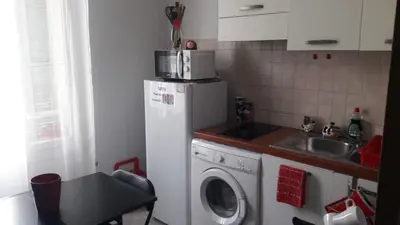 a kitchen with a washing machine and a sink at F1 Cozy & Stylish in Hyper-Centre in Nice