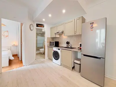 a kitchen with a refrigerator and a sink at Charmant 2P près du Negresco et de la plage - 3pers in Nice