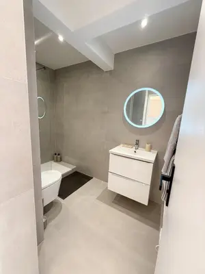 a bathroom with a sink and a toilet and a mirror at Port de Nice, Appartement 4pers emplacement idéal tout équipé balcon in Nice