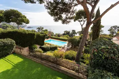 an image of a garden with a swimming pool at LA SOLEILLADE VI4451 By Riviera Holiday Homes in Èze