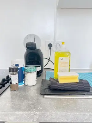 a counter top with a bottle of soap and other kitchen items at La Bella Niçoise in Nice