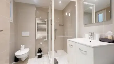 a bathroom with a shower and a toilet and a sink at La Bella Niçoise in Nice