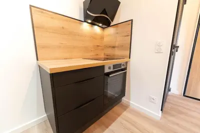 a kitchen with a counter top and a stove at Nice Centre - Loft - Balnéo 1 in Nice
