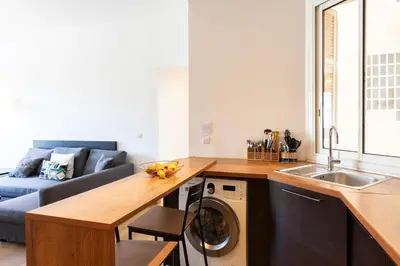 a kitchen with a sink and a washing machine at #37 1BDR Bagatelle, Promenade, sea front Balcony & AC in Nice