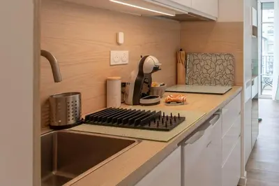 a kitchen with a counter with a sink and a stove at #26 Idealy located flat AC 2mins walk to Sea balcony in Nice