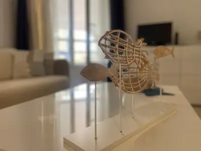 a sculpture of a bird sitting on a table at Perfect Studio Nice Beach Airport in Nice