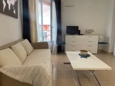 a living room with a couch and a coffee table at Perfect Studio Nice Beach Airport in Nice