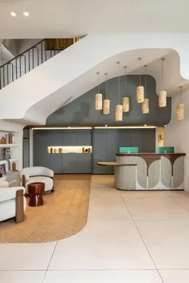 a rendering of a hotel lobby with a staircase at Ikonik Marengo in Nice