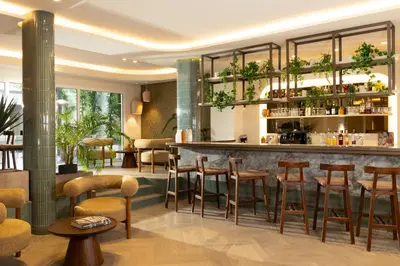 a bar in a restaurant with stools at Ikonik Marengo in Nice
