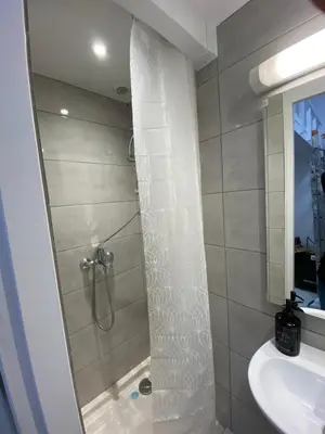 a bathroom with a shower and a sink at Studio Garibaldi in Nice