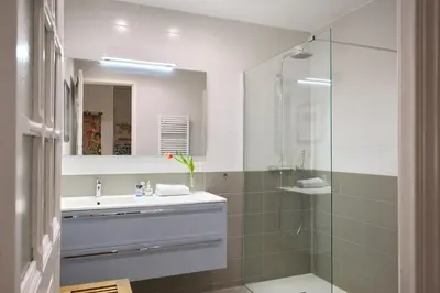 a bathroom with a sink and a shower at Sunlight Properties - Gisele - Nice hyper central, 1 bedroom with large living room in Nice