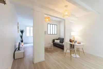 a living room with a couch and a table at #16 1BDR Flower market, Old Town, 1min beach AC in Nice