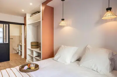 a bedroom with a white bed with two pillows at NEW! Remodeled & Spacious 4 Bedroom - 3 Bath - Heart of Nice - AC in all rooms - With a large elevator in Nice